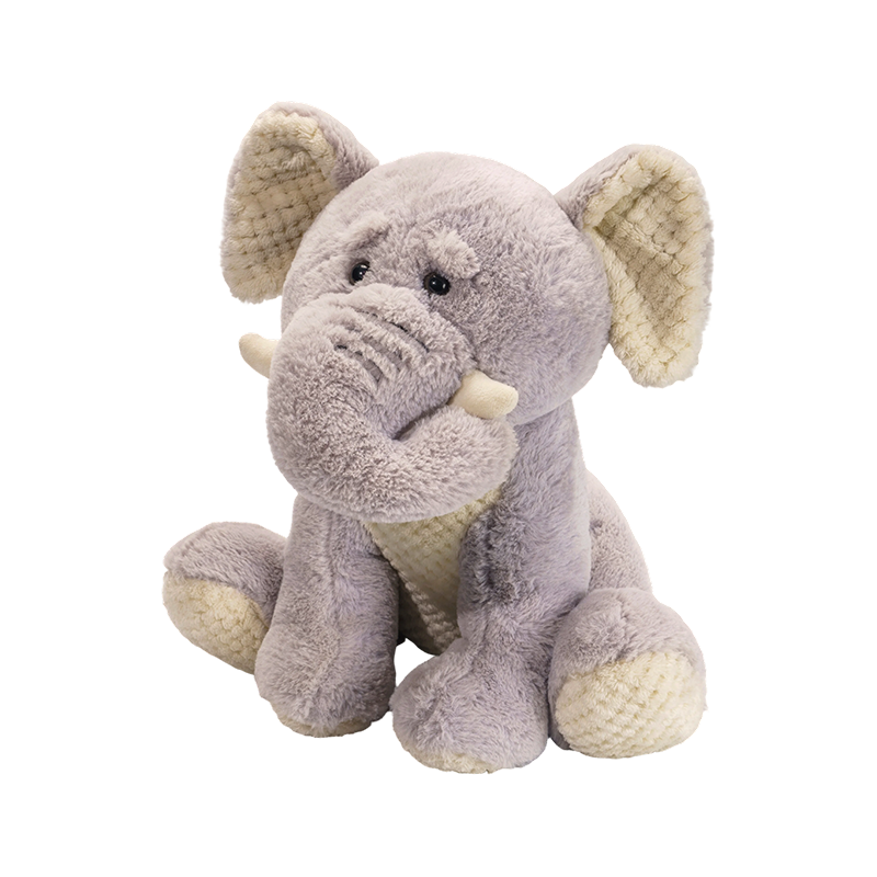 Peluches éléphants assis avec un long nez et de grandes oreilles